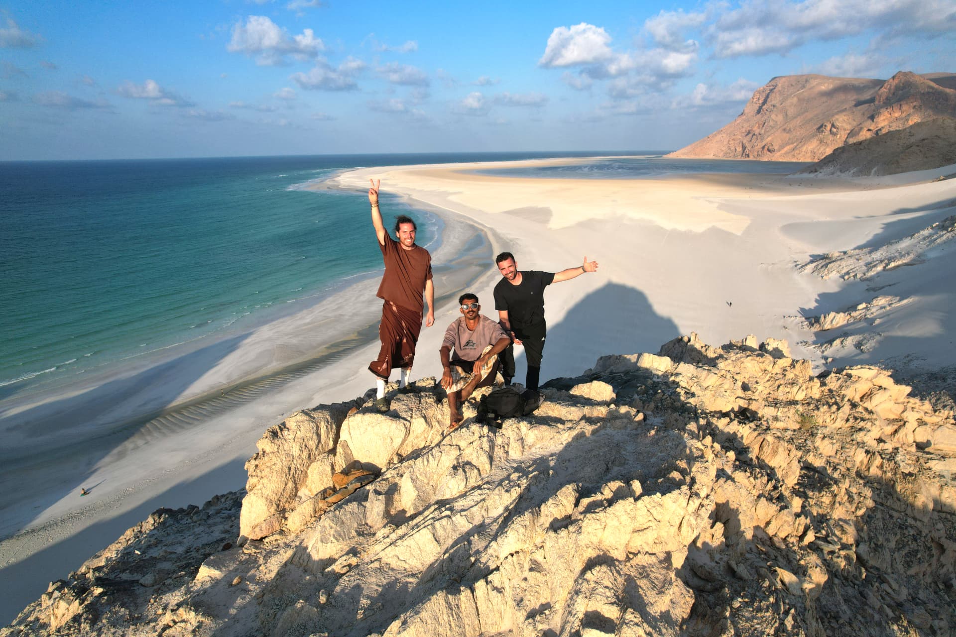 Travellers on a limestone lookout above the Detwah sandspit.
