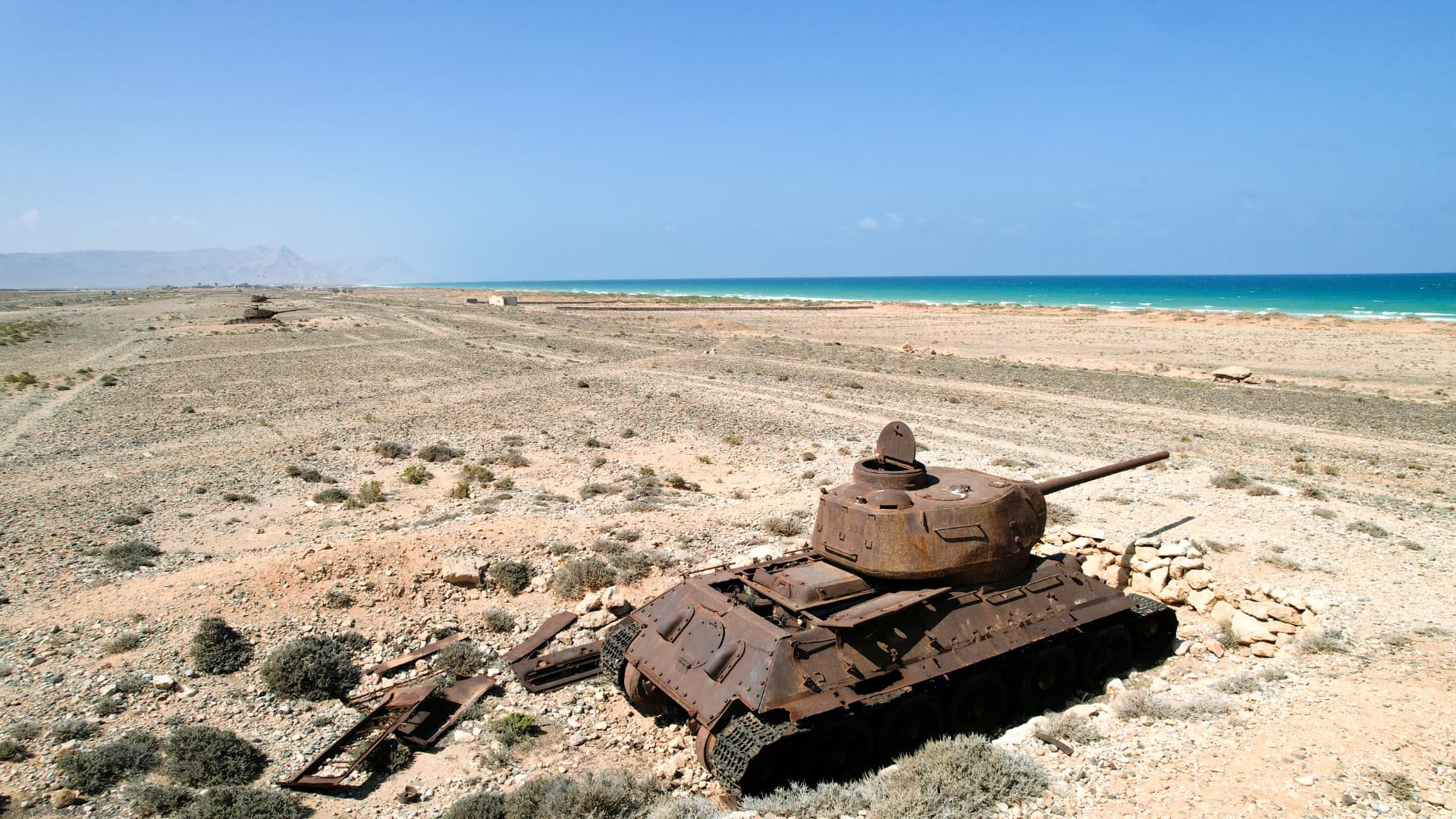 Rusted tank on the coastal plain near Hadibo.